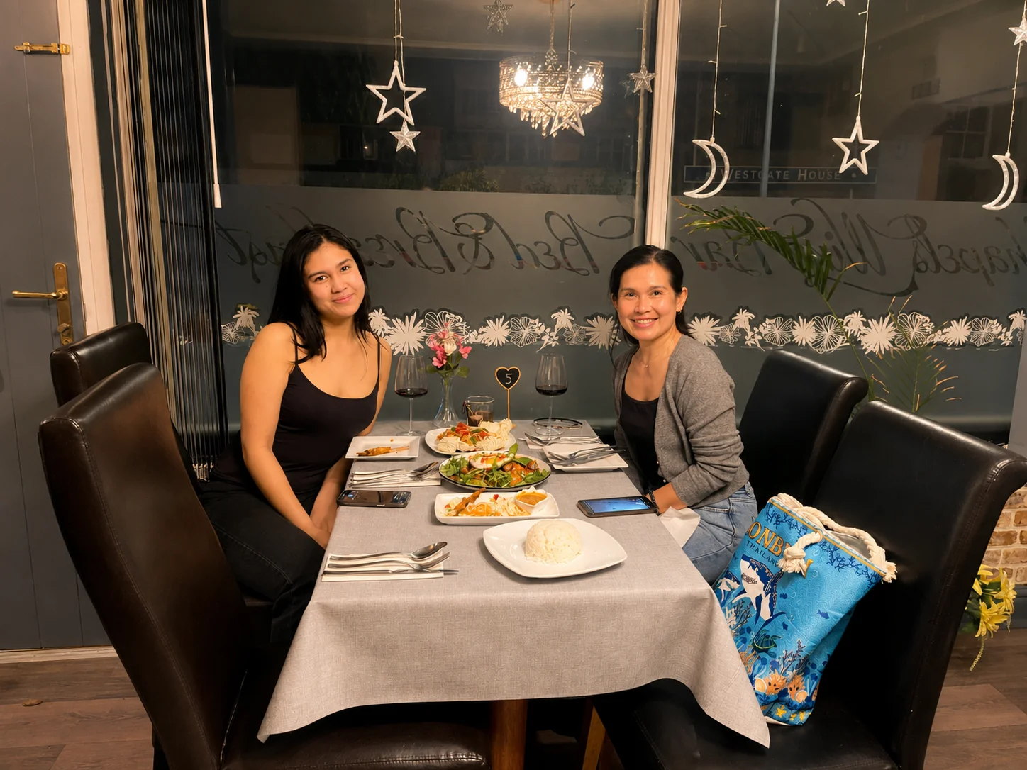 Guests enjoying Thai food and wine at Tawan Chay
