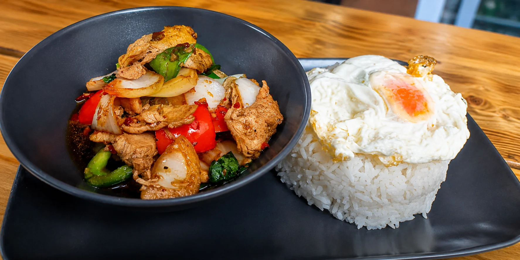 Thai basil chicken stir-fry with rice and fried egg