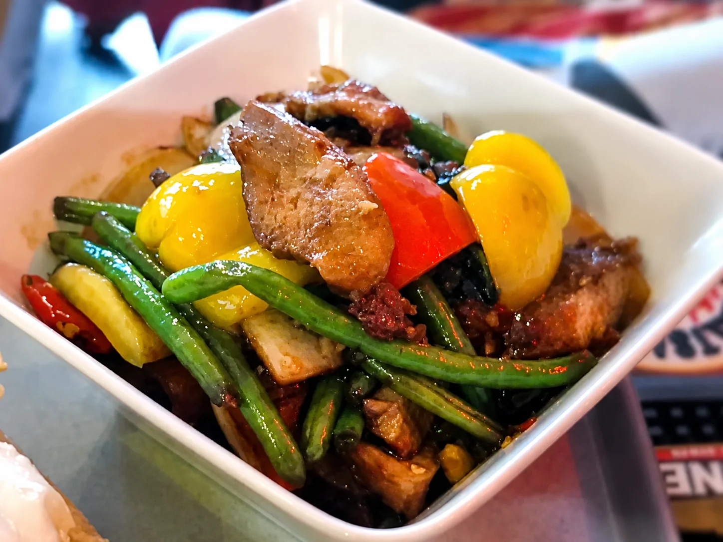 Crispy pork stir-fry with green beans and peppers at Tawan Chay