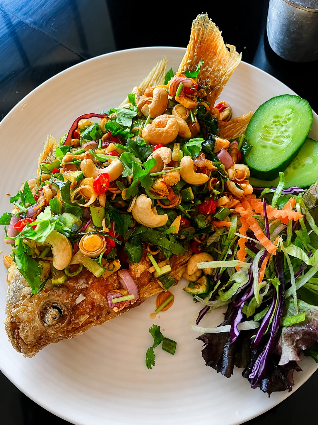 Deep-fried whole fish with cashew and herb salad at Tawan Chay