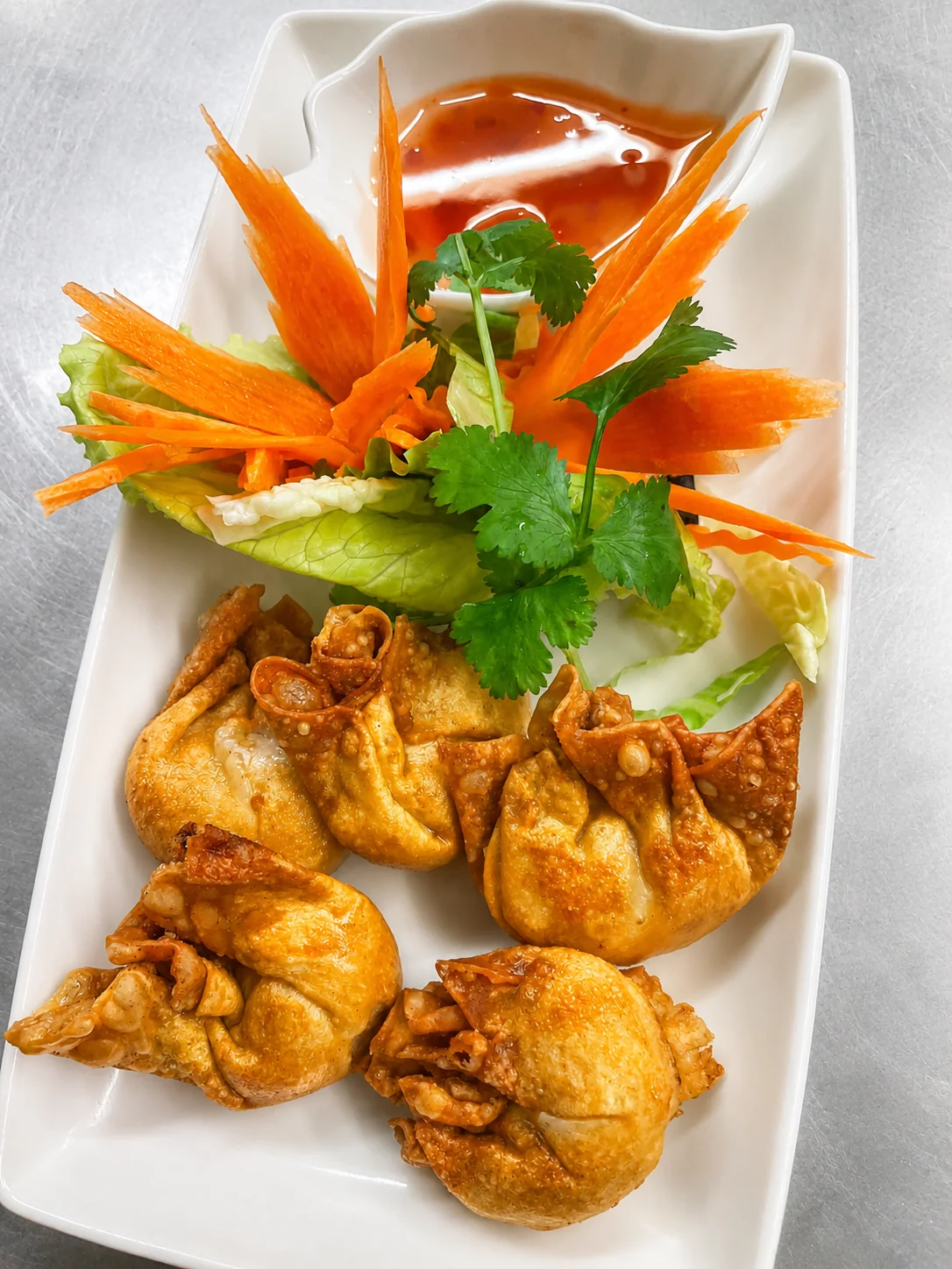 Golden fried wonton appetizer with sweet chili sauce