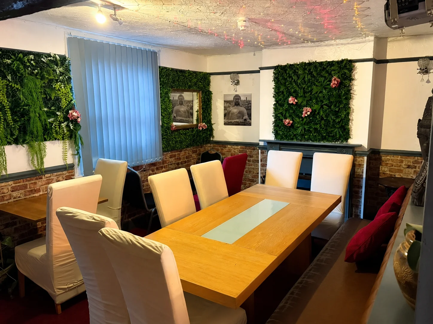 Private dining room at Tawan Chay with green wall panels