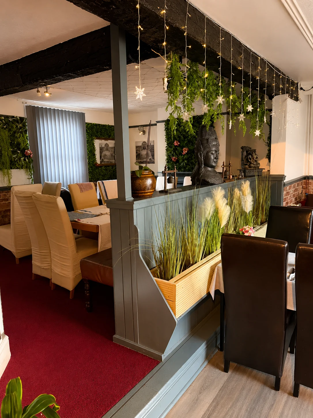 Restaurant seating areas with Thai decor at Tawan Chay