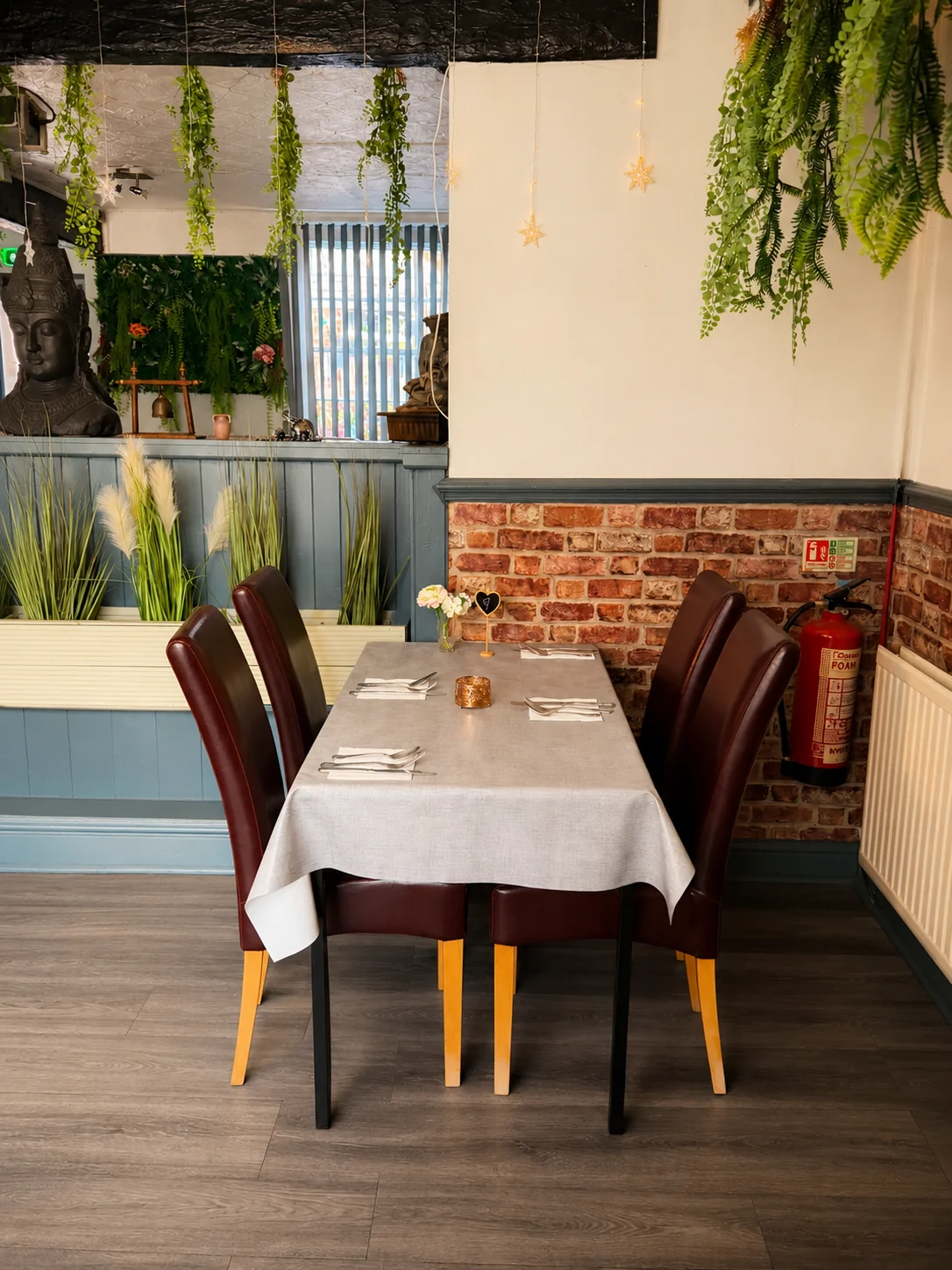 Table for four with white linen at Tawan Chay restaurant